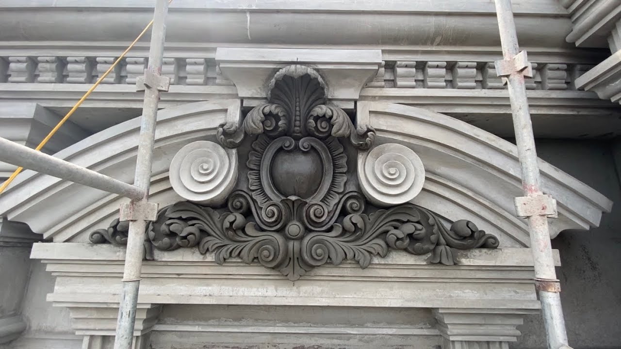 Reliefs surround the door with cement