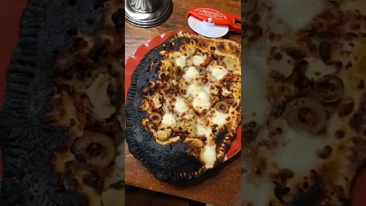 one burned and three perfect Ooni Pizzas