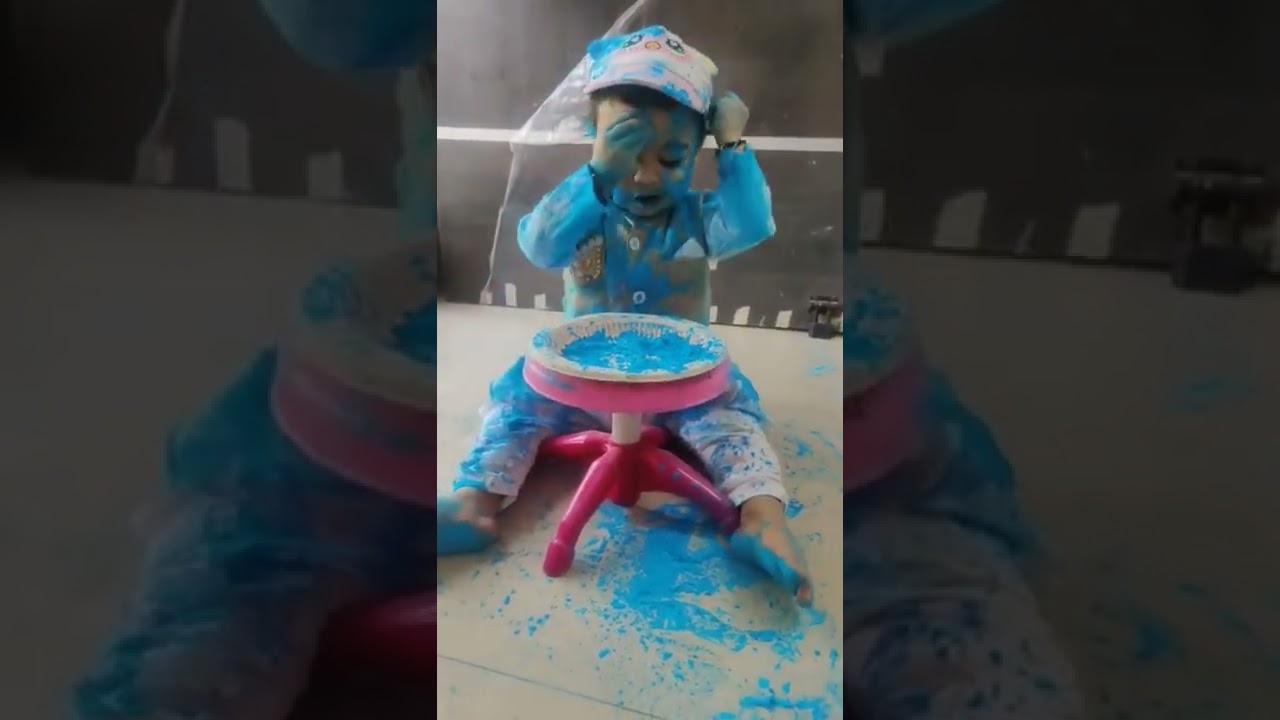 cute baby playing Holi 😋