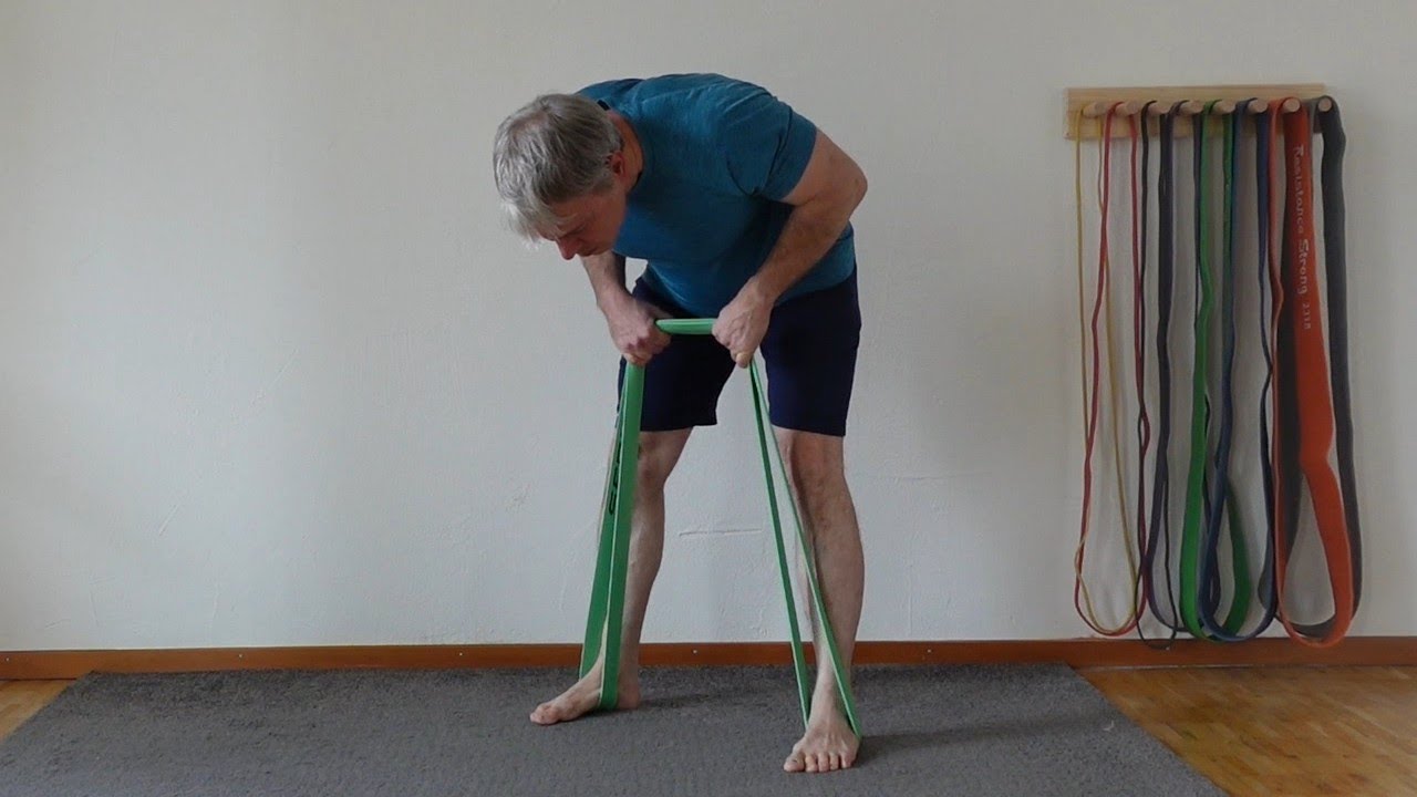Build rear delts and upper back with resistance band high rows