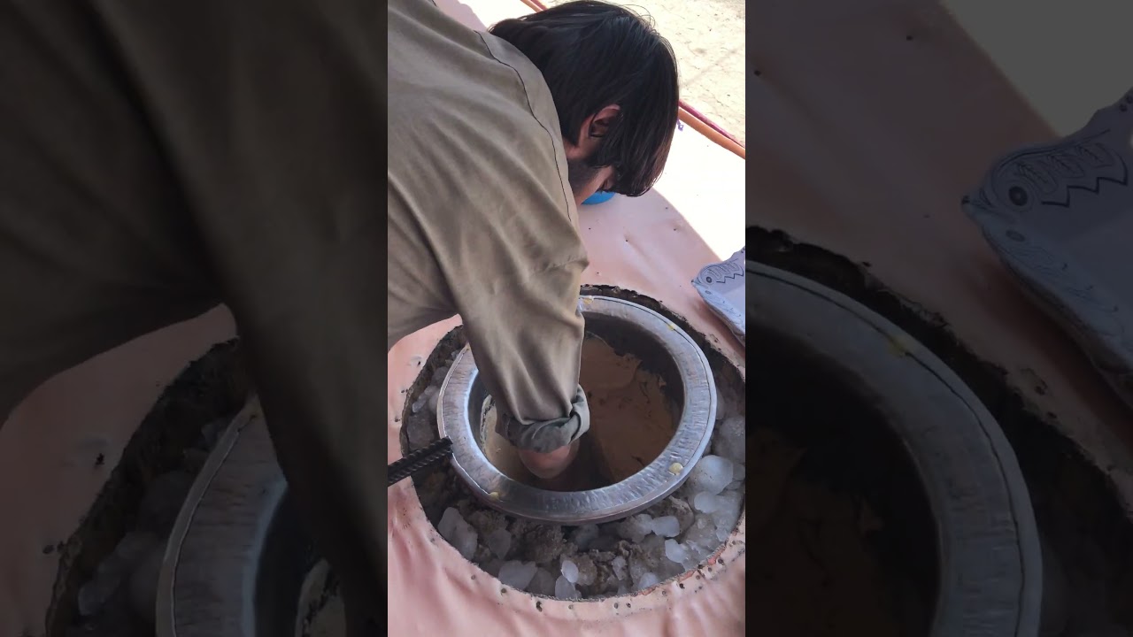 Ice cream maker in the town of Balkh, preparing Sheer Yakh - an Afghan version of Kulfi ice cream.