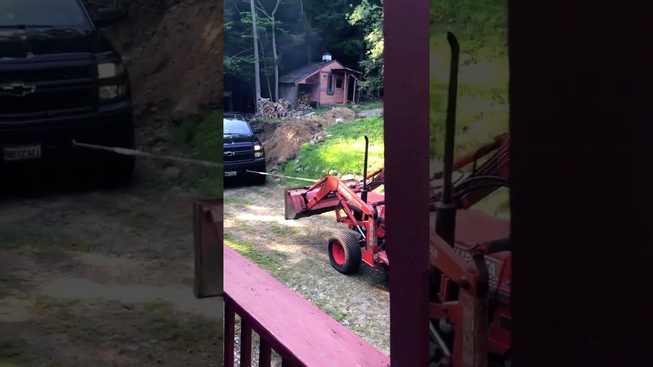 Kubota tractor pulls a stuck Chevy!!  #kubota #Chevrolet