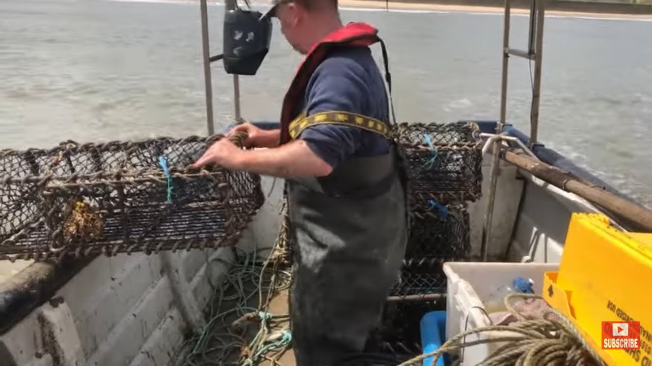 Hauling a few crab and lobster pots. Poor weather and following seas. Beach boat sea fishing