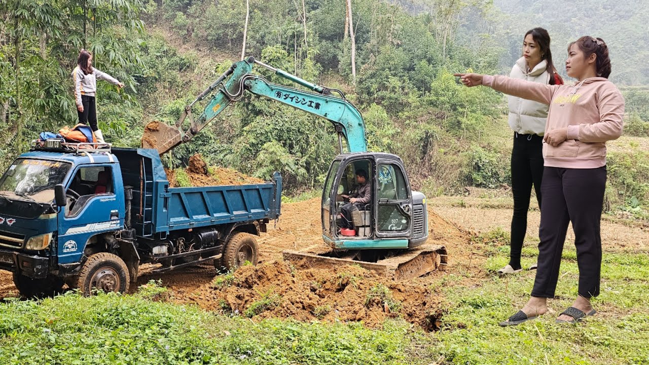 Excavators and trucks The river has been made a lake for fish.