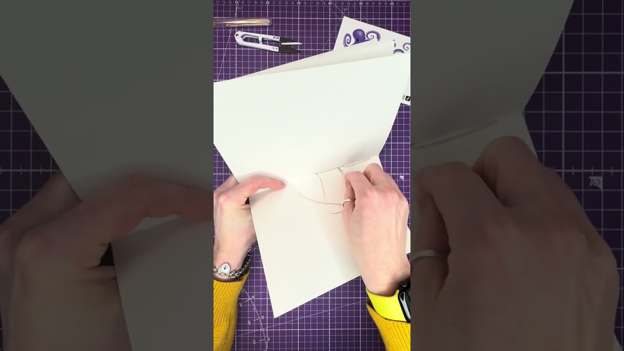 Bookbinding saddle stitch and kettle stitch. 