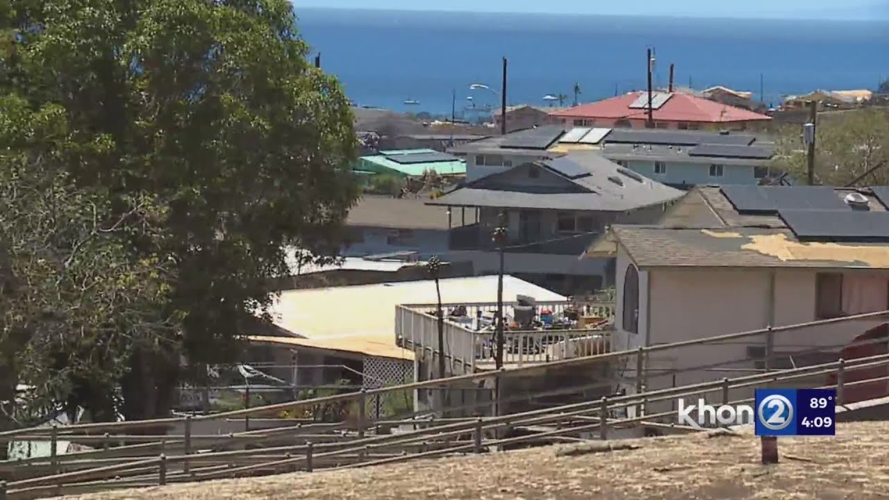 A light in Lahaina town as one community remains standing