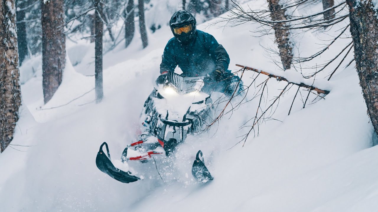 HARDWOOD SNOWMOBILE TREE-RIDING IN SAINT-RAYMOND, CANADA – TRENCHERS