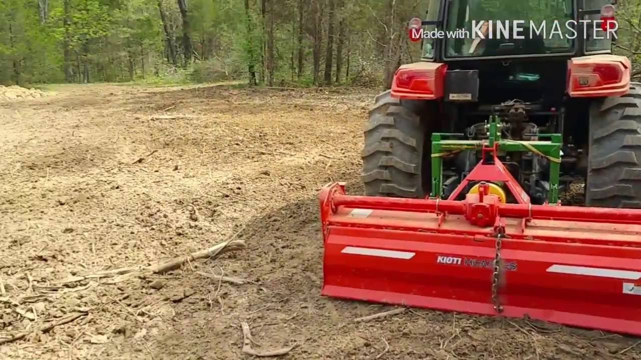 Kioiti NX6010 Tilling deep woods plot, rough, root filled ground