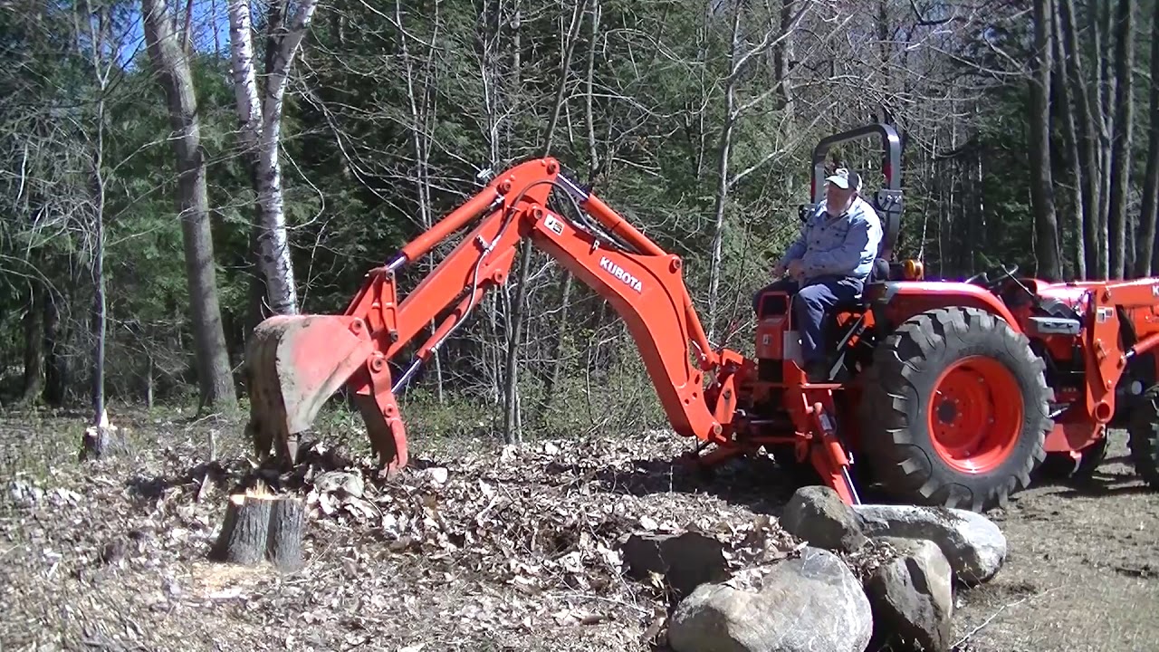#18 Kubota BH92 Backhoe Pulling Rocks