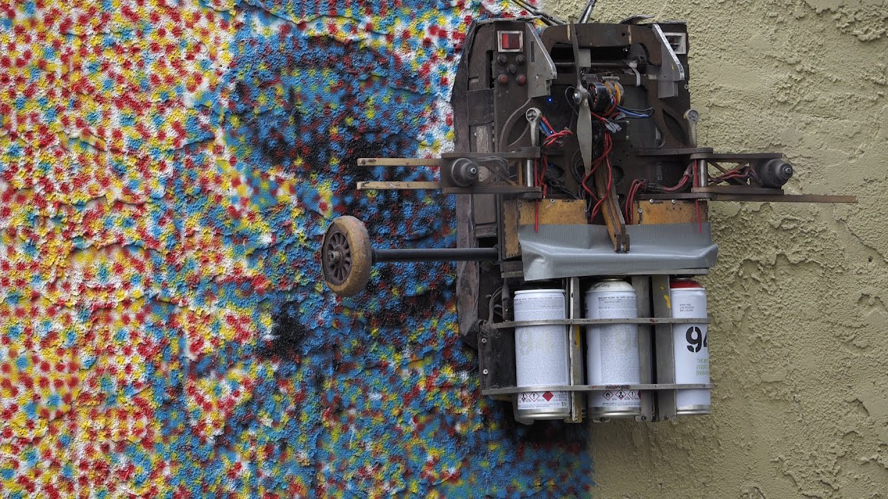 Robotic inventor spray paints gigantic mural using a color printer robot in West Orange