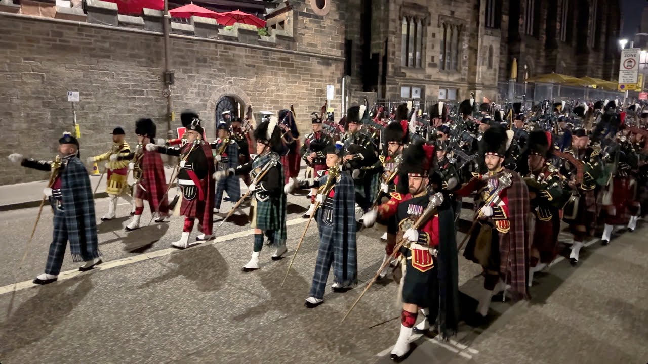 Scotland the Brave as the Drum Majors lead the massed pipe band march out Edinburgh Tattoo on VJ Day