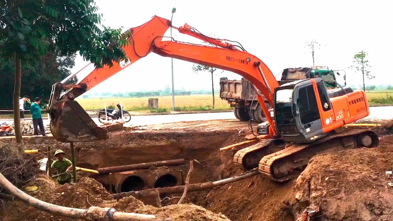 KOBELCO excavator for demolition works, excavator dump truck working   Excavator, truck