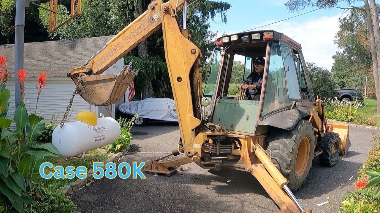 Setting a Propane Tank with a Case 580 Backhoe