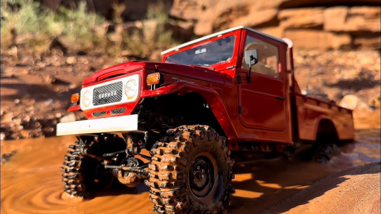 FMS Lifted FJ45 scale drive in mud and water. 