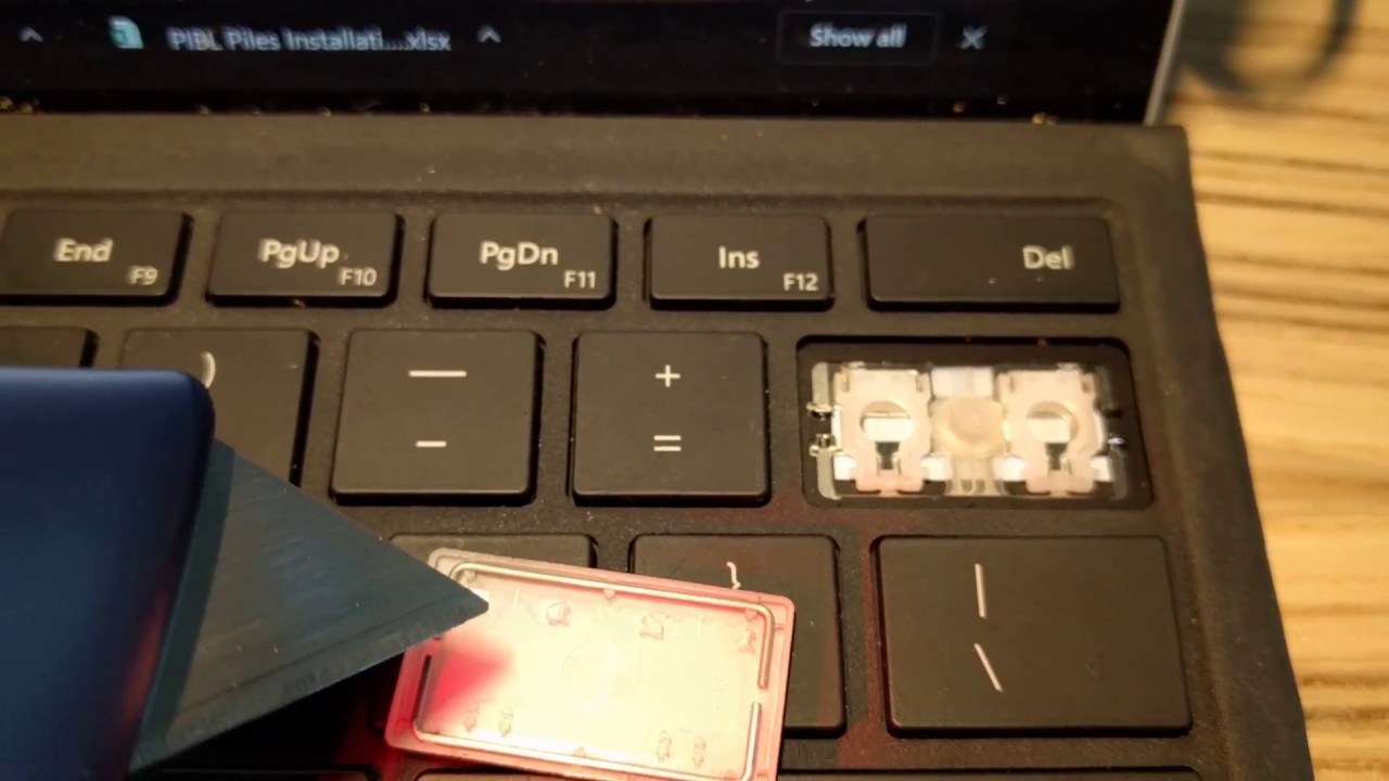 Remove and reinstall or replace keys on Surface Pro 4 Keyboard.