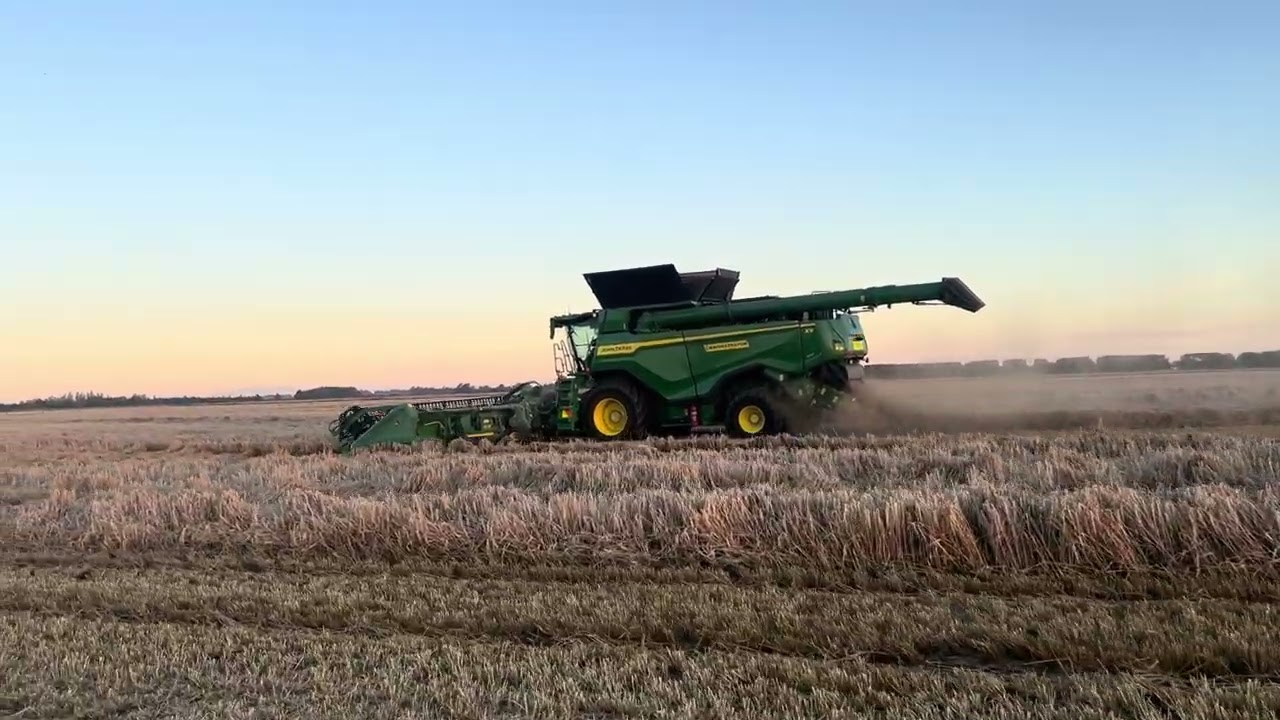 John Deere X9 heading late barley in Canterbury New Zealand 