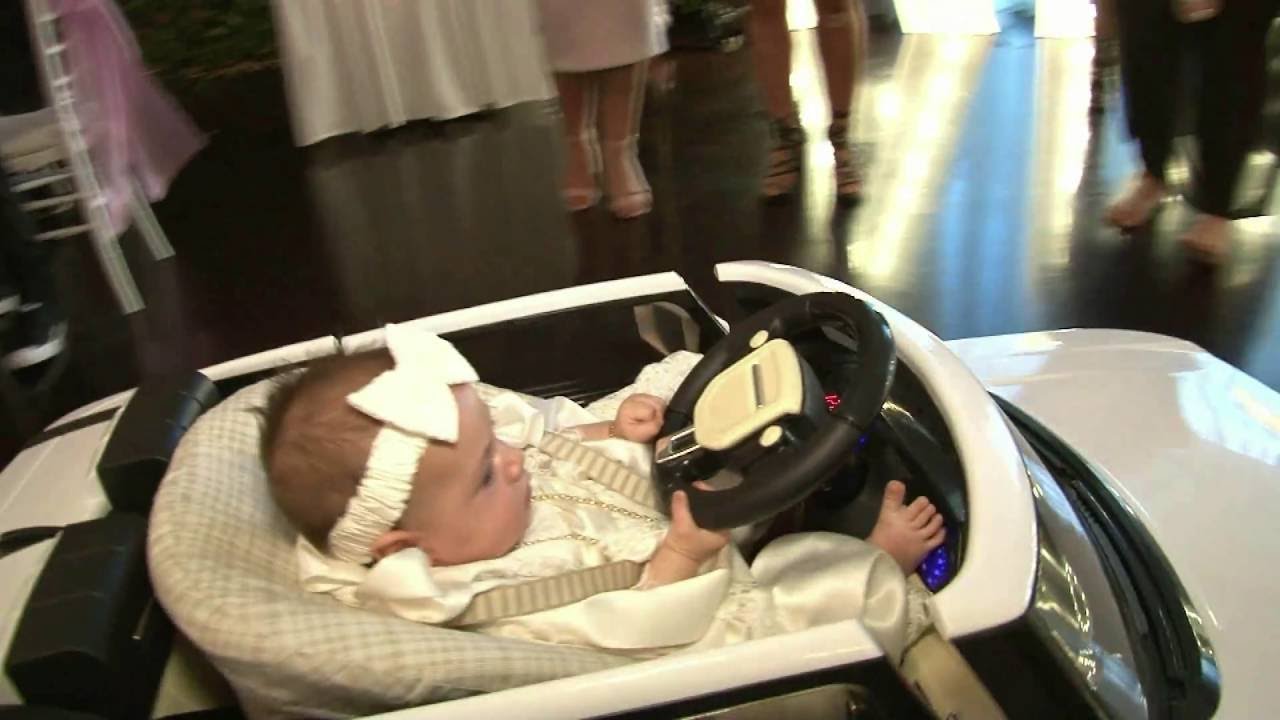 Baby's Grand Entrance in a mini Range Rover