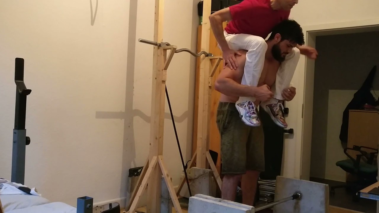 Frank lifts 100kg. heavy concrete weights and takes me away.