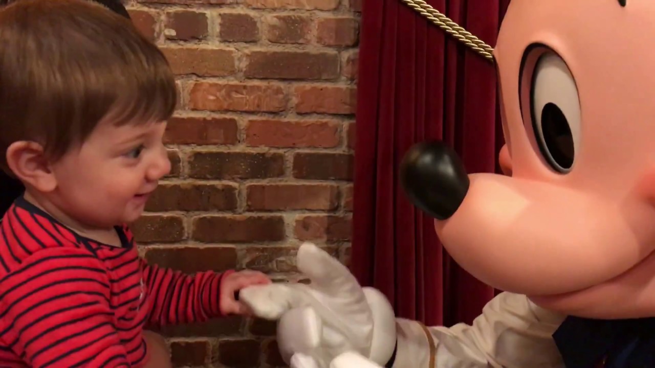 Baby meets talking Mickey/Magic Kingdom!
