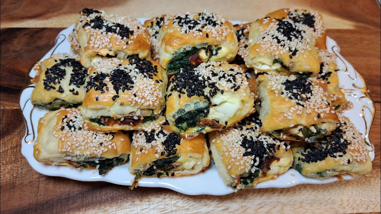 Sun-dried tomatoes, Greek feta and spinach in puff pastry are a great party snack.