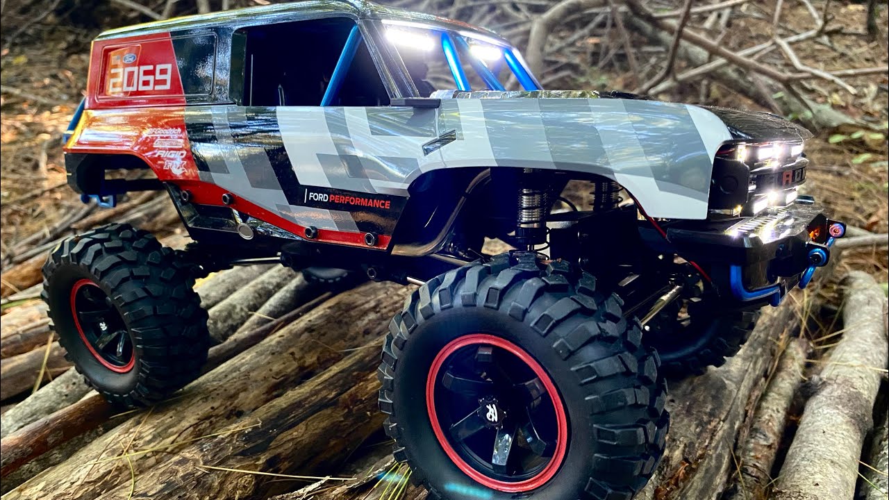 MJX H12P 1/12 Bronco R new scale wheels/tires, and better slow speed control.