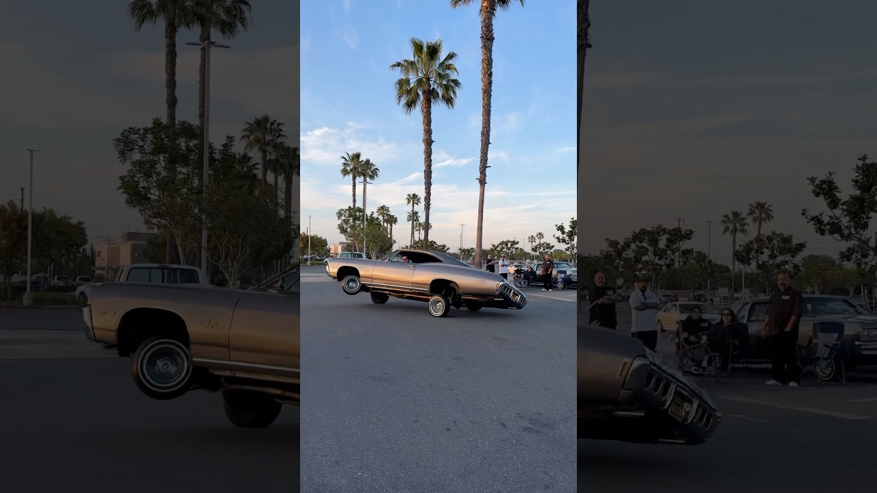 1968 Chevy Impala Lowrider tippin&rsquo; in 3 wheel motion to bend the corner at a classic car show!