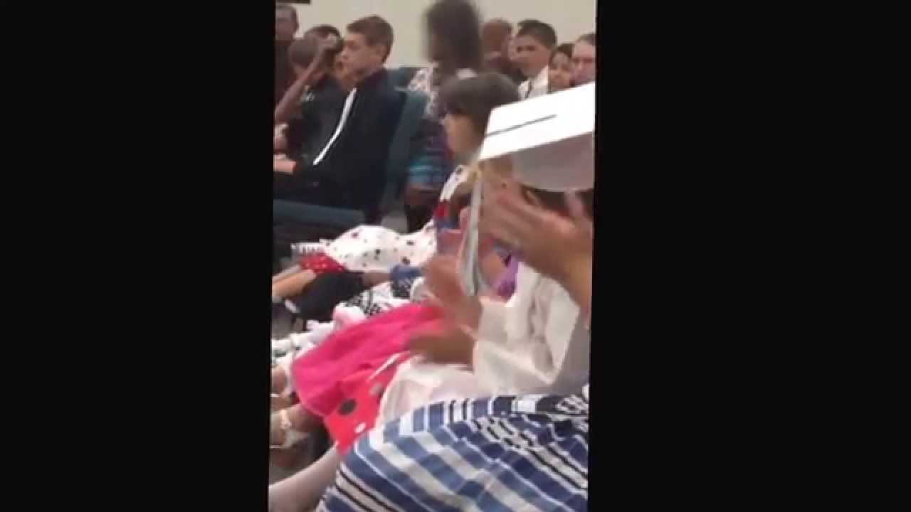 Little girl can't stay awake for her graduation.