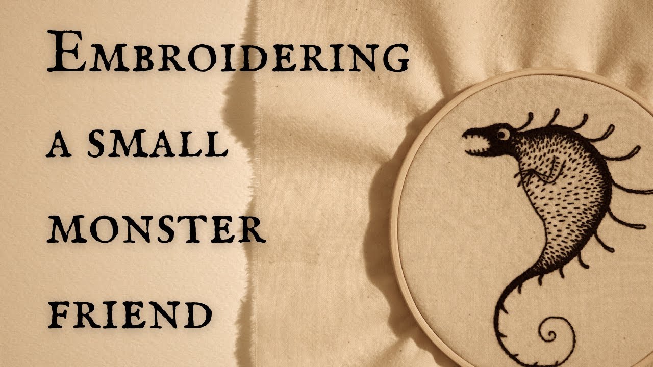 Hand embroidering a small monster