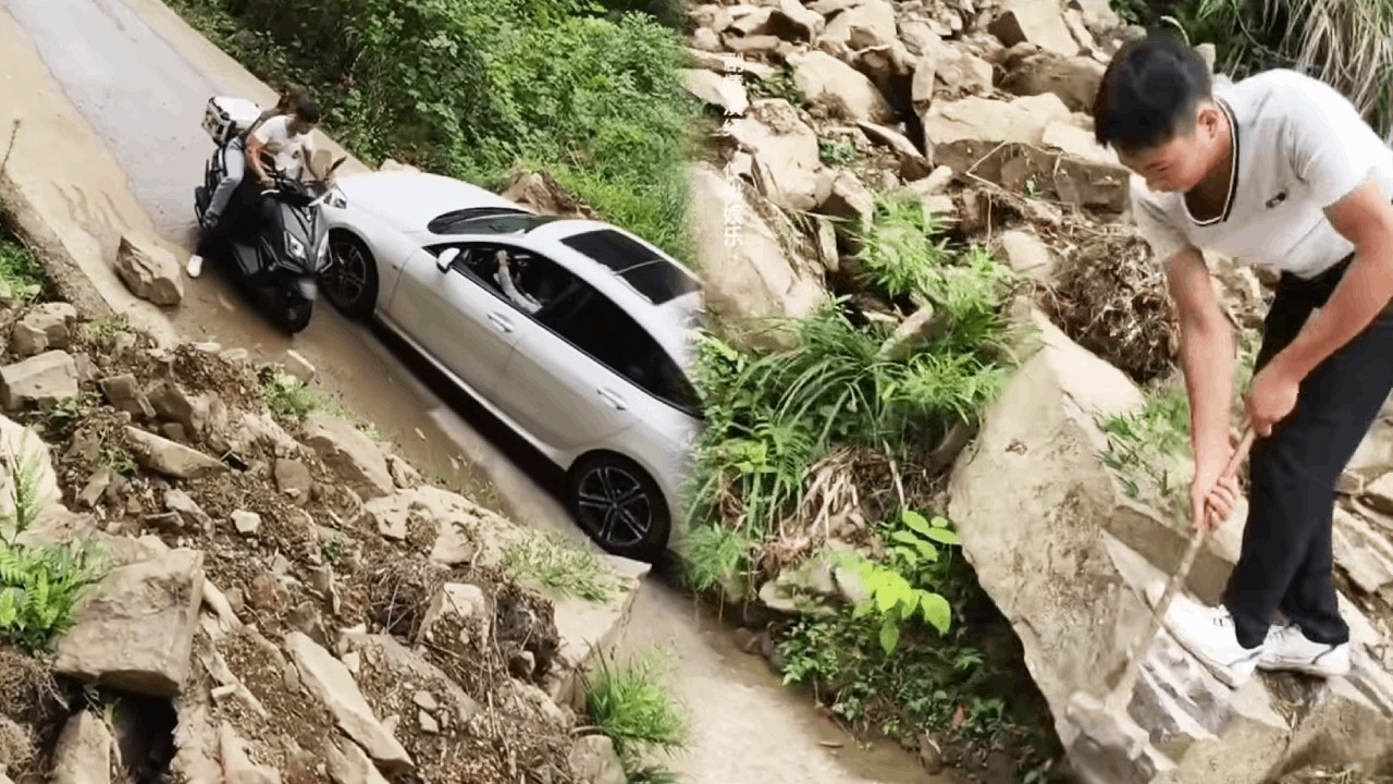 The kind couple moved the huge boulder that was blocking traffic to the side of the road.