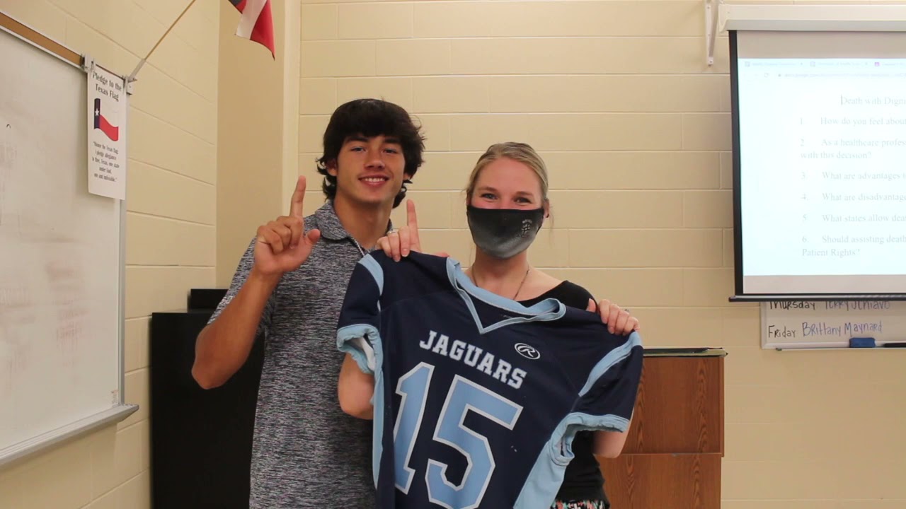 Football players gift teachers jerseys near game days