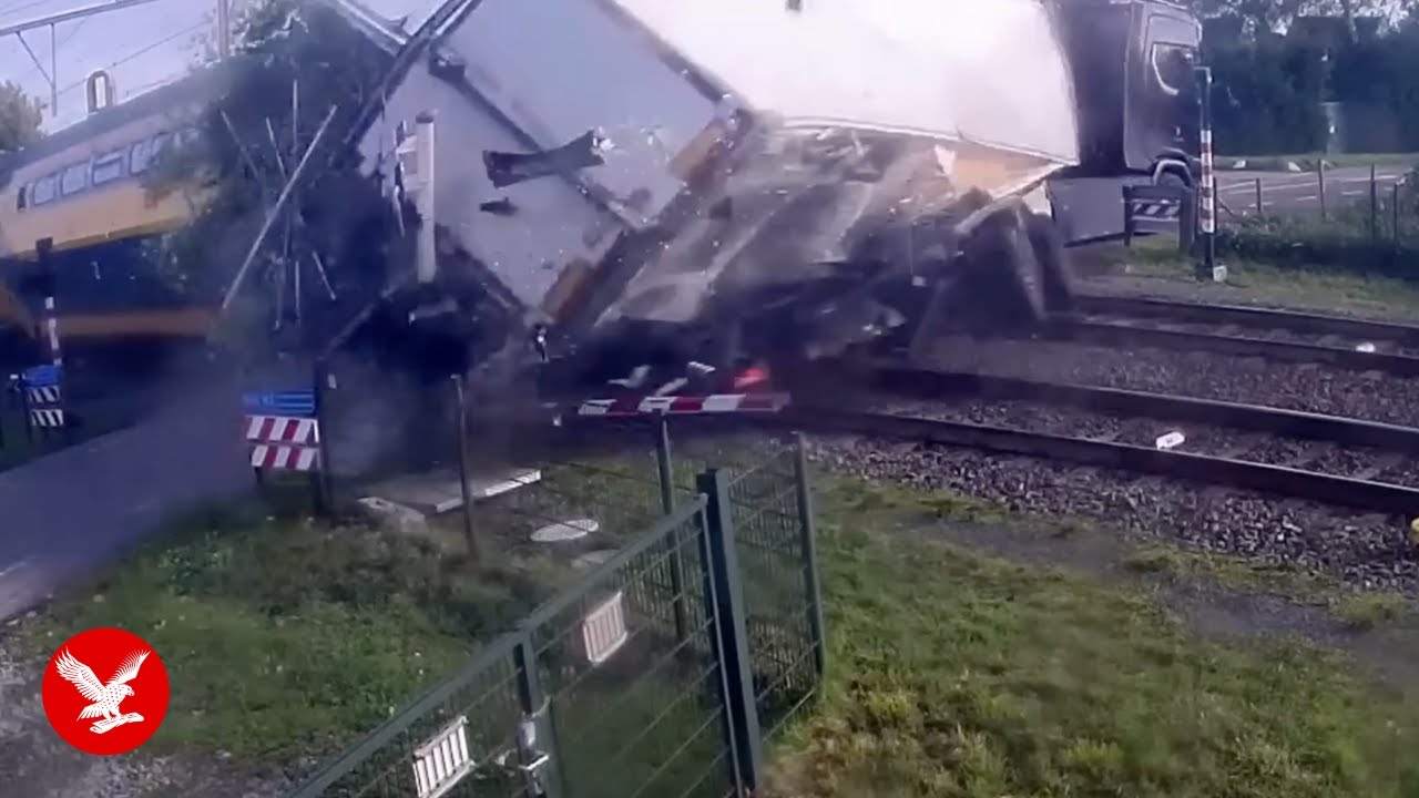 Train smashes into lorry caught on level crossing
