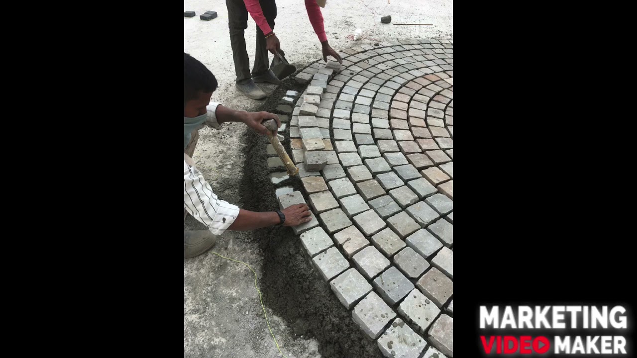 Cobble stone fixing work at podium level