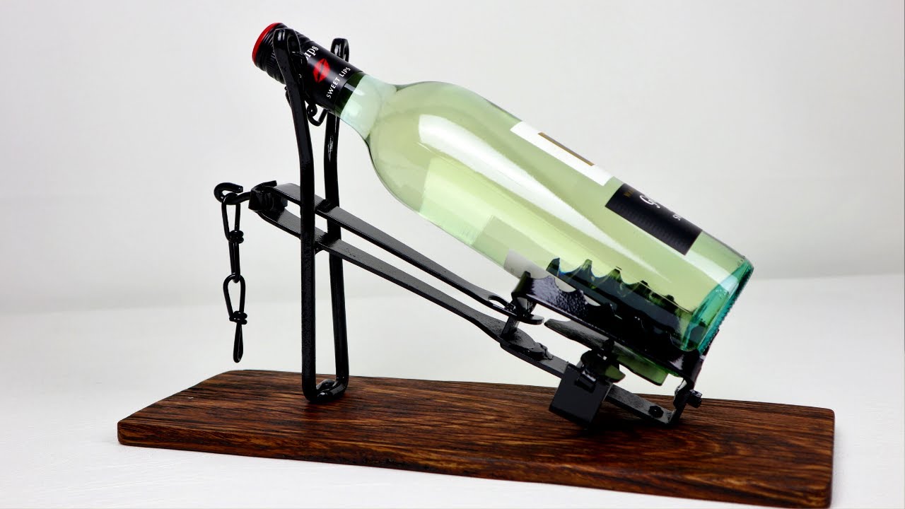 I make a Wine Bottle Holder using a Rabbit Trap, Man Cave Whiskey bottle display welding project.