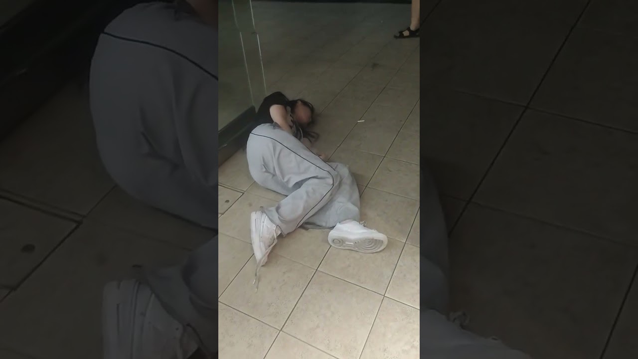 Drunk Japan. Drunk Japanese lady is sleeping in front of Shinjuku station. Drunk weekends in Tokyo