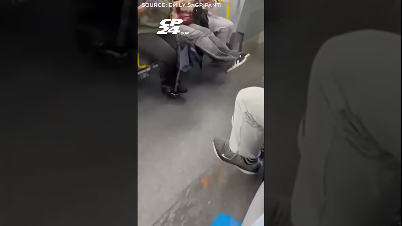 Floodwaters flow over floor of a TTC bus during thunderstorm