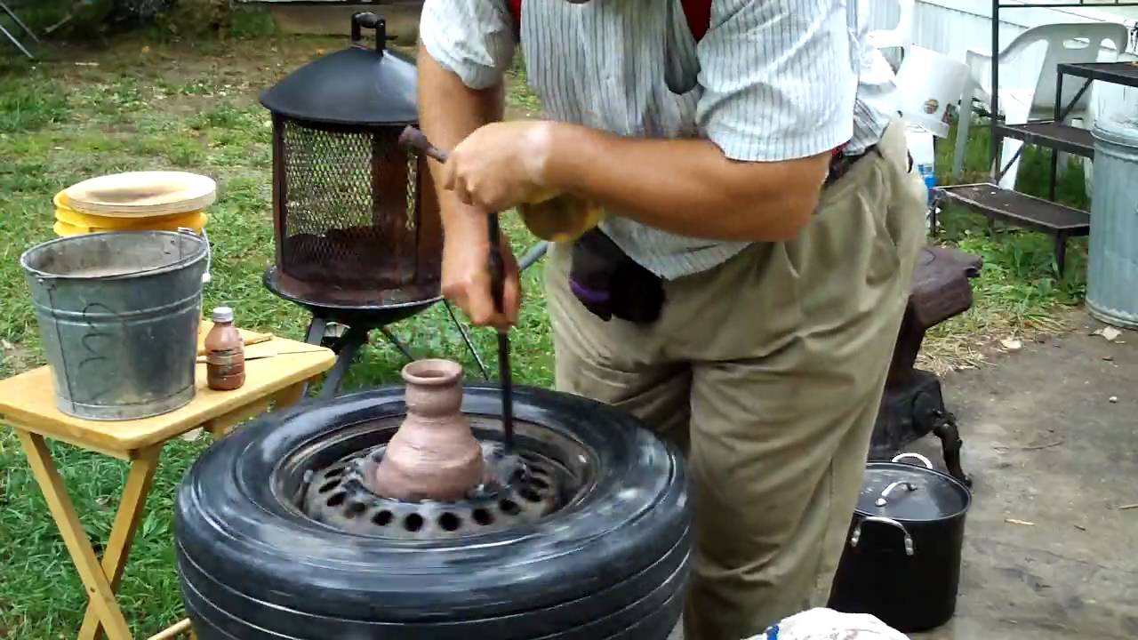 pottery throwing demo on a car tire~by Hillar Bergman