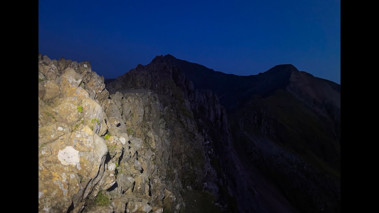 Climbing Crib Goch's knife edge ridge at night - 4K