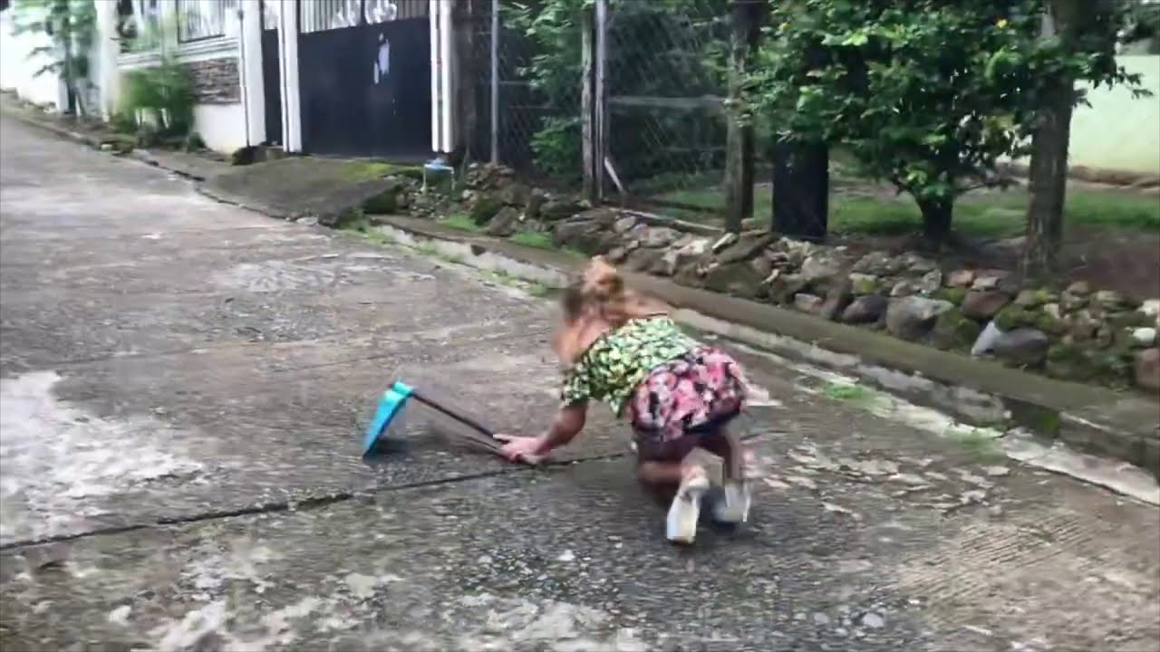 Filipino Girl FALLS while trying to garden in platform shoes!