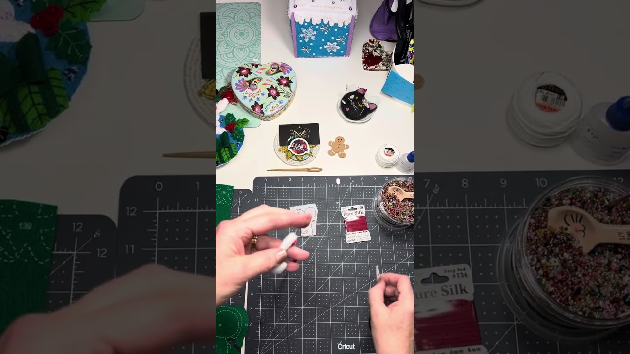 Wrapping felt candy canes with #bucilla silk embroidery ribbon instead of #satinstitch .