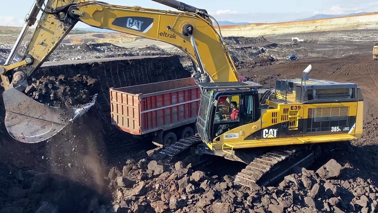 Caterpillar 365C Excavator Loading Coal On 4 Axle Trucks | Massive Coal Mine Operation - Interkat SA