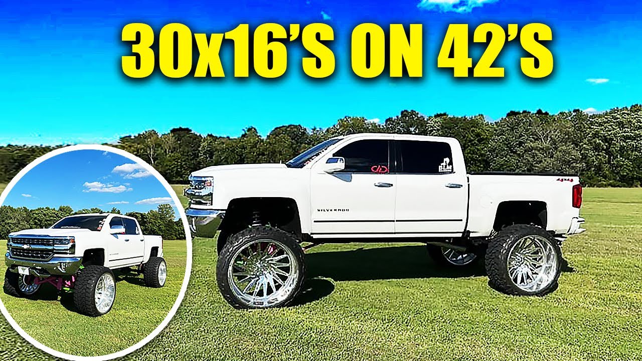 He mounted 30x16's & 42 inch tires! Huge lifted Silverado on Cognito!