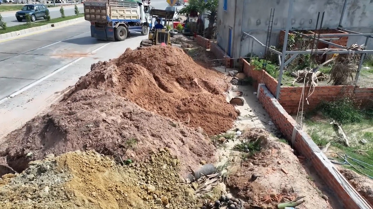 Good work with good experts is being done to reclaim land from ASEAN Road to fill this small plot.