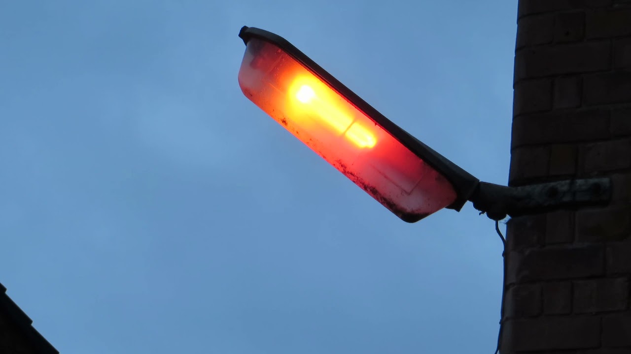 Old UK Street Light Turning On