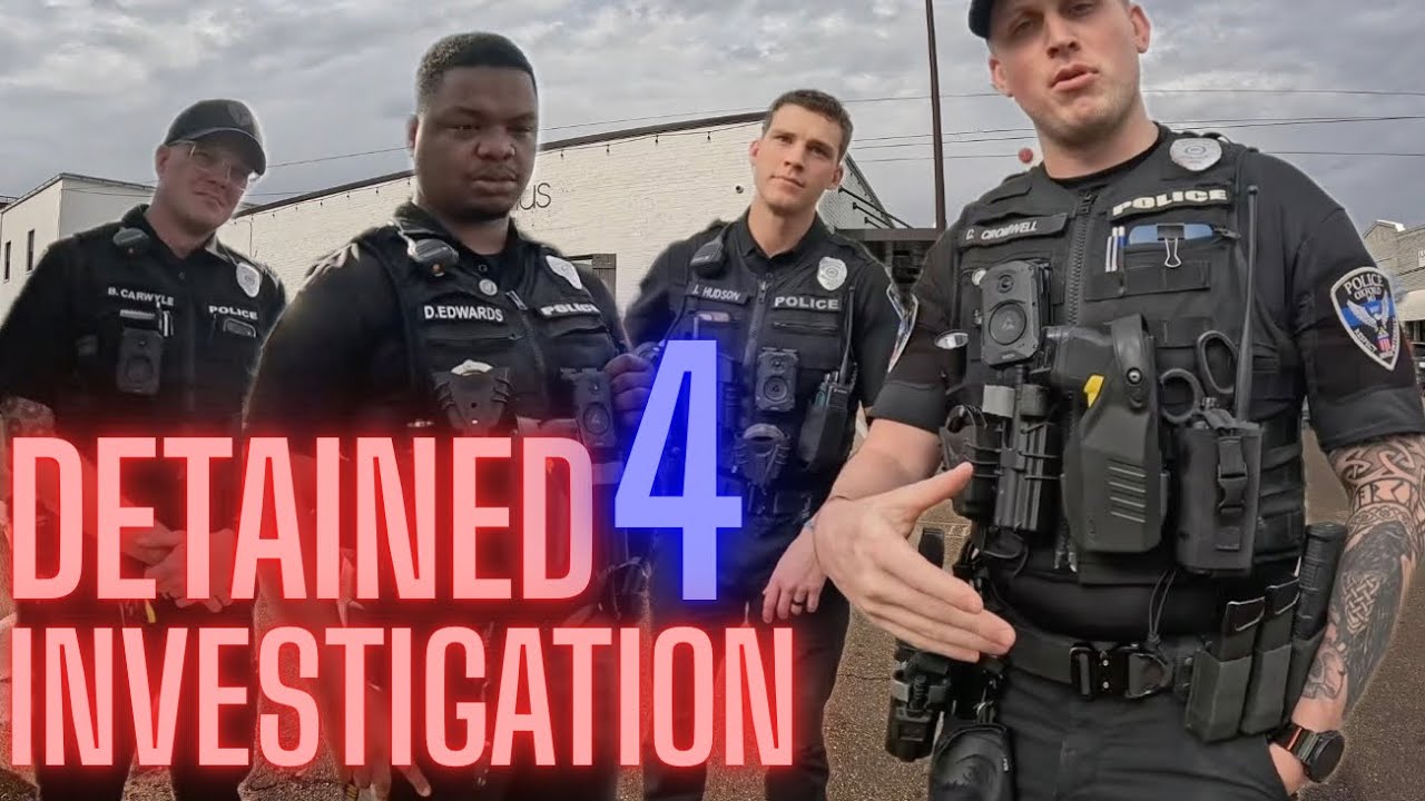 Officers Detain Men With Cameras For Investigation