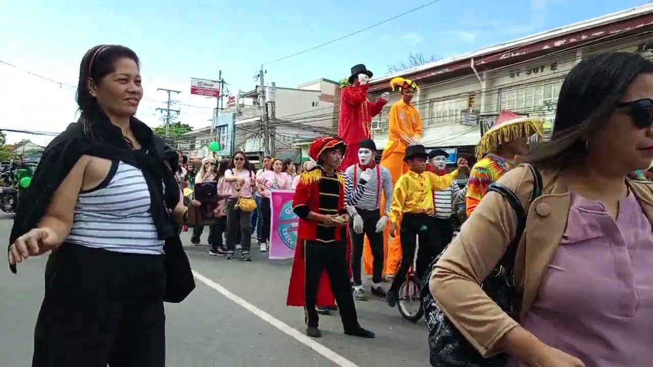 Drumbeaters, stilt walker, unicyclist, juggler, mime, Parade at Gerona Junior College 