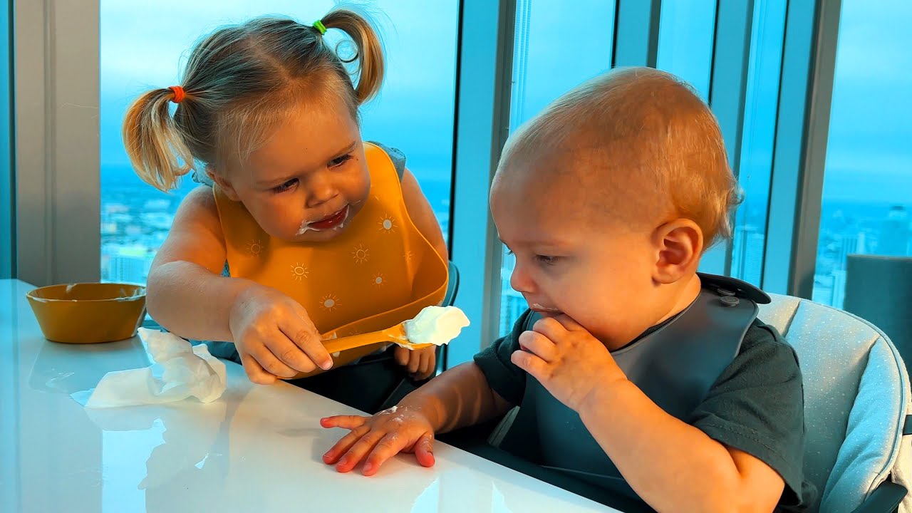 How older toddler takes care of her younger brother