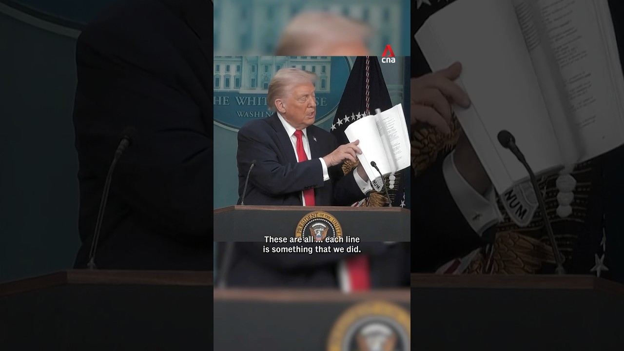 Trump throws his 'book of accomplishments' on the floor during press briefing