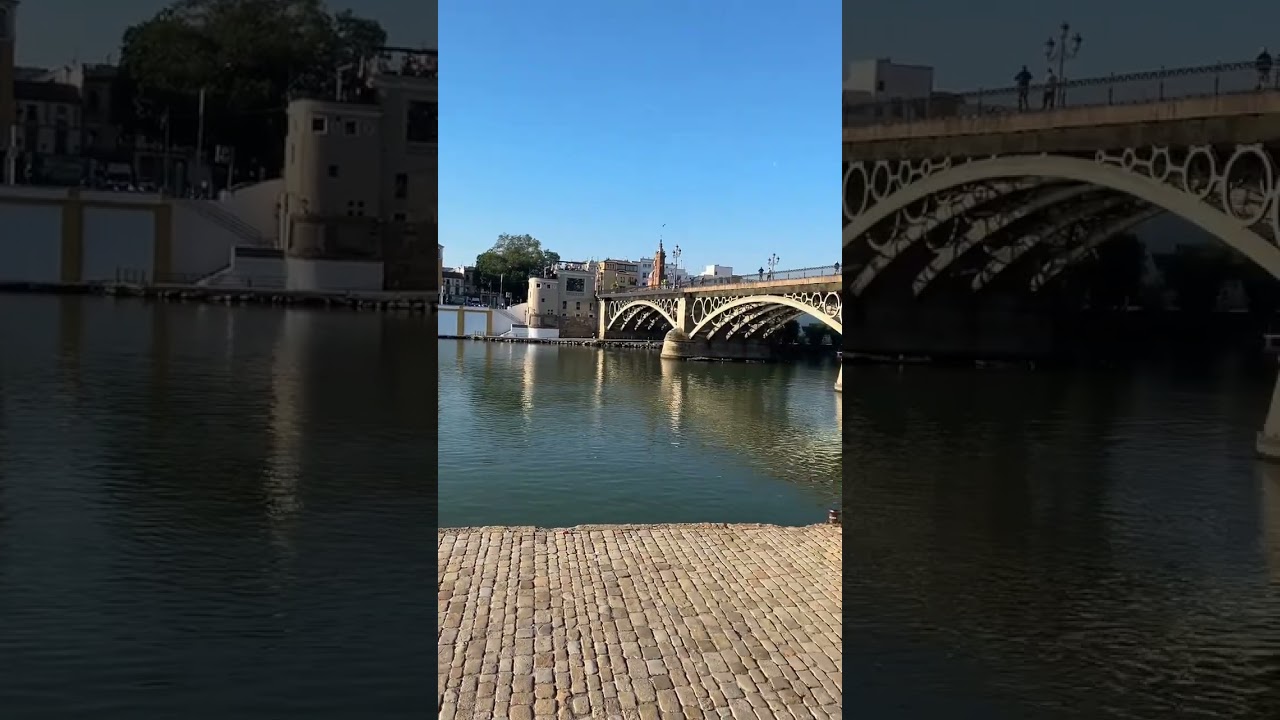 Seville view of Puente de Triana from Canal de Alfonso XIII