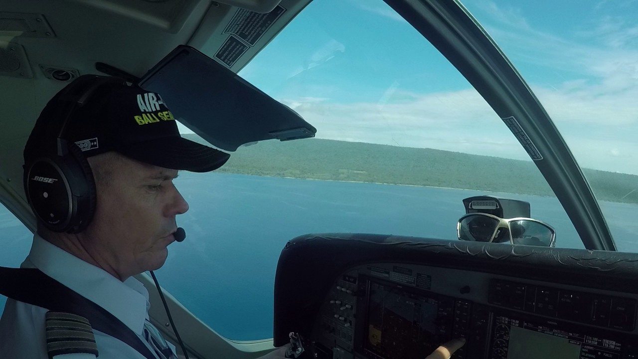 Amphibious Cessna C208EX Caravan water landing at Moyo, Indonesia