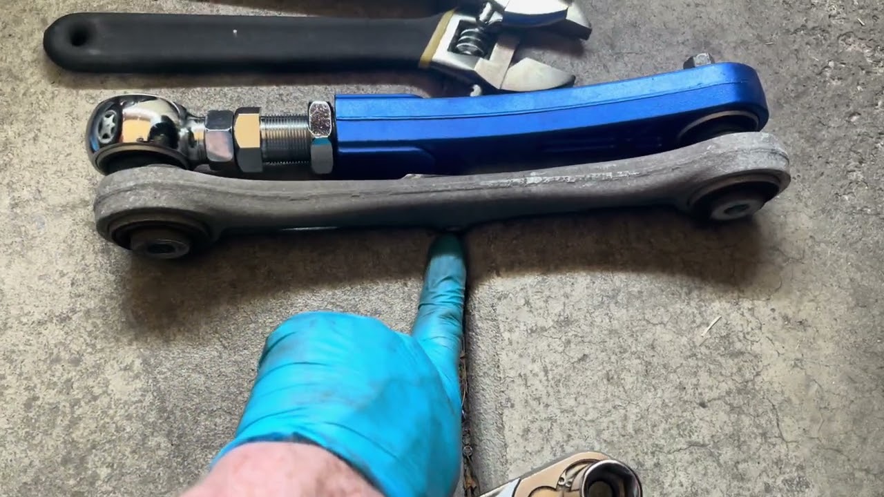 Installing camber adjustment arms on a tesla model X
